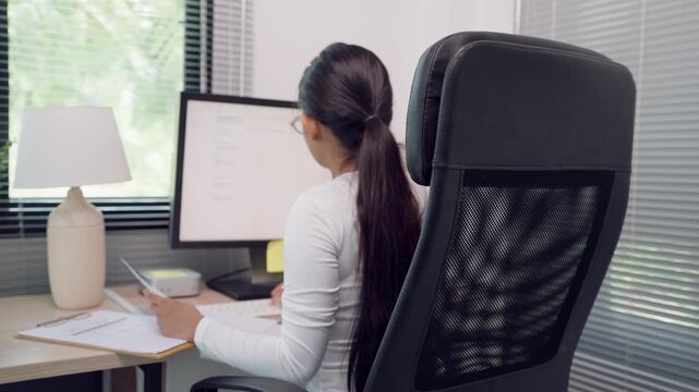 Close up of female hands typing on computer keyboard at office desk. Concept of business communication, data entry, productivity, and modern digital workplace technology.