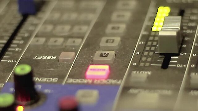 professional music mixing desk close-up audio control panel faders knobs with led lights studio equipment sound engineering with no people stock footage stock video