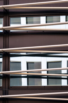 Abstract modern building architecture facade with lines layers shadows and texture forming a bold pattern background for minimal design use