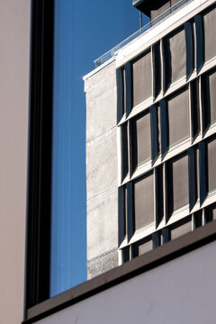 Minimal modern building architecture facade with windows sky lines and abstract urban space creating a calm geometric background for designers
