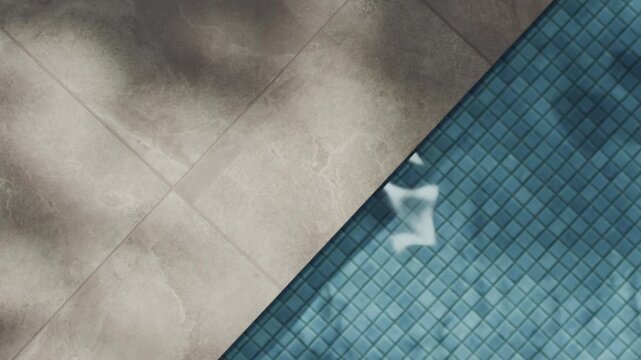 Pool water summer background with palm shadow from above. Tropical poolside granite tile hotel resort. Neutral aesthetic product placement for beauty, spa, skincare and business luxury brand. 