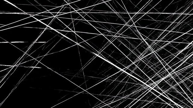 Abstract monochrome image featuring white lines crossing a dark black background