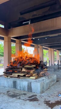 Hindu Cremation Ritual with Burning Pyre at Traditional Cemetery