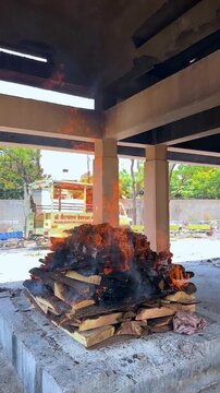Hindu Cremation Ritual with Burning Pyre at Traditional Cemetery