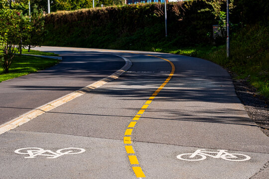 Open road markings in Oslo Norway suggest bicycle commute transport through urban city street planning where cycleway infrastructure mobility supports sustainable travel