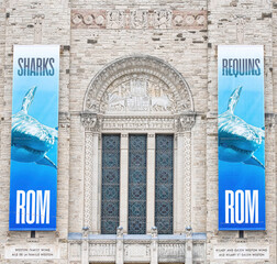 Fototapeta premium Banners for a shark exhibition on the exterior colonial facade of the Royal Ontario Museum, Toronto, Canada