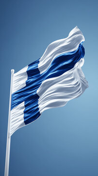 finnish flag finland waving in the wind in blue sky