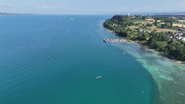 Panorama flight over Lake Constance (Bodensee) with marina and ferry berth near island Mainau near Konstanz, Germany