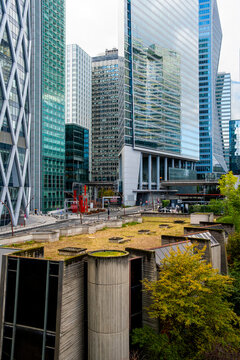 Urban finance business hub with modern architecture as glass skyscrapers form skyline in La Defense Paris featuring greenroof terrace