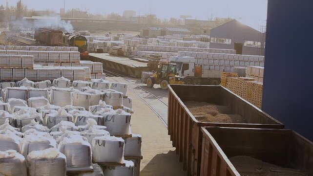 A freight car moves through a factory warehouse. Industrial rail freight transportation.