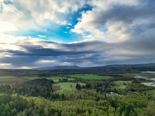 Obraz premium April 19th, 2026. Aerial View of Balmaha Valley Glasgow Landscape During Sunset Time. The village is a popular tourist destination for picnickers and day trippers from Glasgow