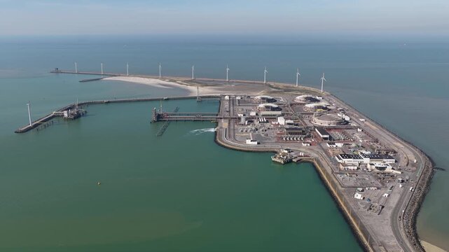Aerial view of lng terminal and wind turbines at dunkirk port