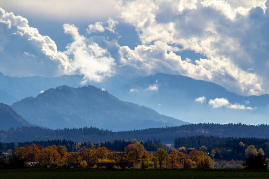 Cumulus clouds above the mountain ridge at the horizon. Vistara in the Gurktal valley, Carinthina, Austria, near Althofen.