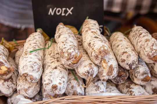 Close up of artisanal walnut saucissons secs at Sarlat morning market