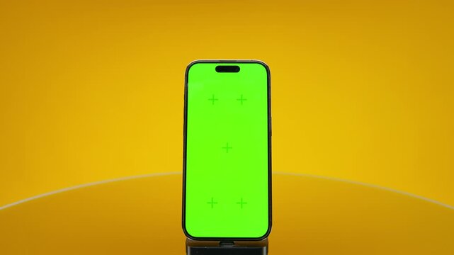 Smartphone Reveal Pack Shot With Green Screen on Yellow