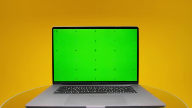 Laptop Fly Out Screen With Green Display on Yellow