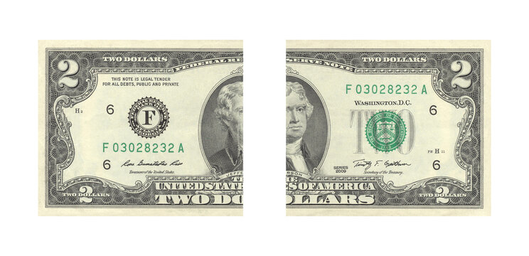 Torn two dollar bill split in half with obsolete currency concept and financial crisis symbolism