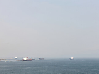 Fototapeta premium Two vessels sailing on the open ocean, calm waters