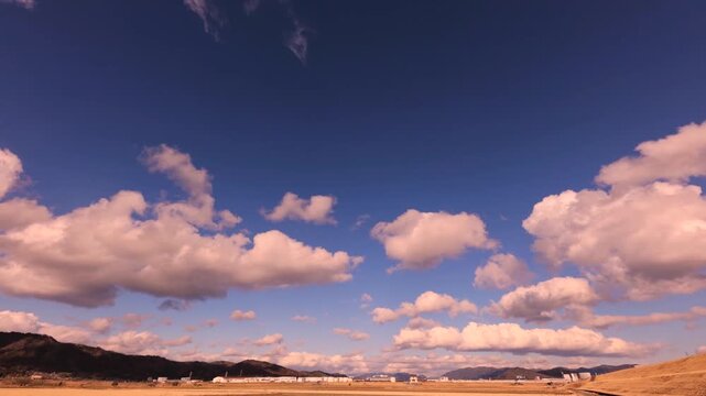 HD Timelapse of Thick Clouds in Warm Tones Moving from Left to Right (No Audio)
