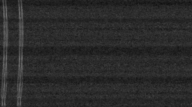 VHS television no signal screen with heavy static, glitch distortion, and analog noise.