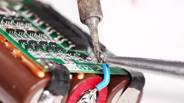 Repairing electronics at a workshop in the city