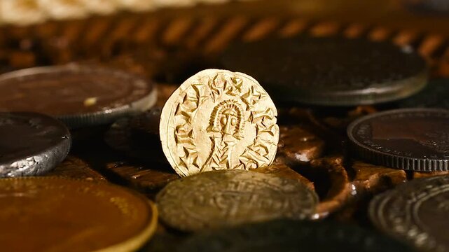 Old Visigothic gold coin in an old rotating wooden chest