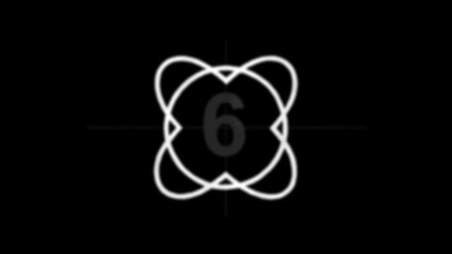 Abstract atomic icon with orbital loops and the number six on a black background.