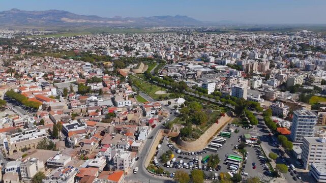 Aerial Bird's Eye Flight East Above Nicosia Old Walled City and Modern Urban Contrast Cyprus