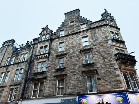 Historic stone building facade with windows and architectural details on Jeffrey Street in Edinburgh, Scotland, UK