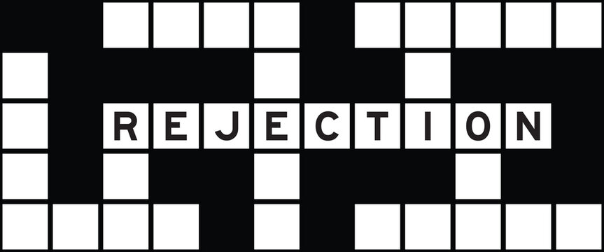 Alphabet letter in word rejection on crossword puzzle background