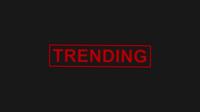 Red animated stamp displaying the word TRENDING appears on a solid black background, highlighting current popular topics or content with a dynamic and eye-catching effect.