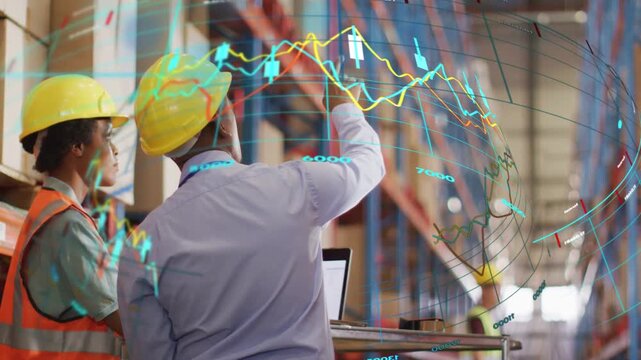 Supervisor using laptop, pointing, tracing AR charts, associate following, reviewing warehouse ops