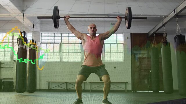 Athlete driving hips pulling barbell catching overhead holding squat while graphs analyzing fitness