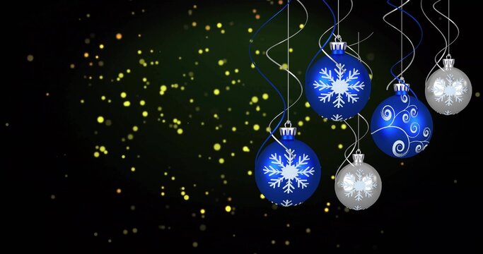 Hanging cluster of five snowflake baubles catching shine on right side, with warm bokeh, copy space