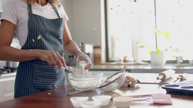 Woman tilting jar and pouring milk while whisking batter, animated stars accenting baking process