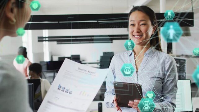 Once peer showing Quarter Report, woman checking tablet as teal hex on tablet showing business data