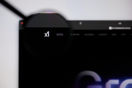 Milan, Italy - 2026, 20 Apr: xAI logo displayed under a magnifying glass on laptop screen displaying the x