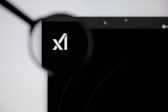Milan, Italy - 2026, 20 Apr: xAI logo displayed under a magnifying glass on laptop screen displaying the x
