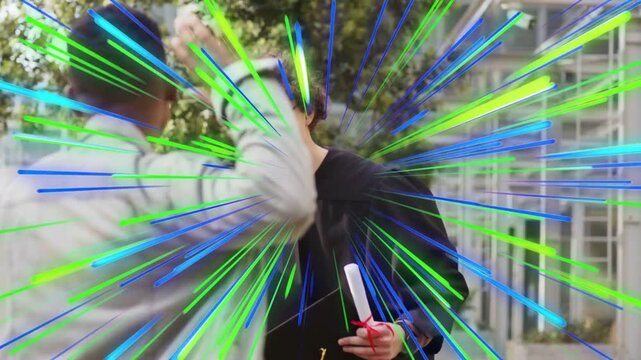 Graduate holding cap, diploma walking, friend stepping in sparking hug, radial streaks marking grad