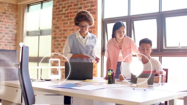 Team tapping tablet, adjusting printout, floating envelope folder pin icons showing business plan