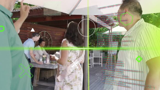 Men clapping and pointing, sashed woman walking to party buffet, green HUD overlays obscuring faces
