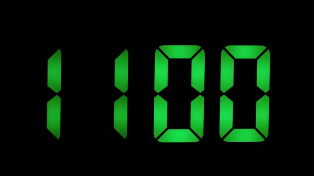 Green digital clock digits illuminated on a black background show the time 10:59. Segmented LED style numbers create a clear and modern numeric display.