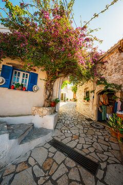 Alley decorated with flowers in the picturesque village of Afionas vacation on the island of Corfu in Greece nearPorto Timoni beach