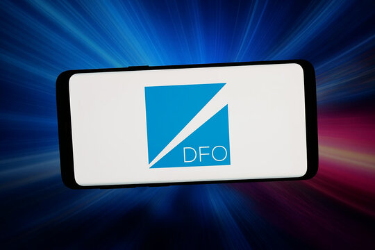 Stuttgart, Germany - 04-13-2026: In this photo illustration, the logo of US investment company DFO Management LLC is displayed on a smartphone in front of abstract background on computer screen.