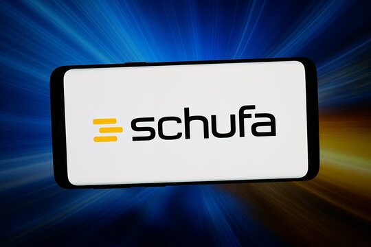 Stuttgart, Germany - 04-13-2026: In this photo illustration, the logo of German credit bureau Schufa Holding AG is displayed on a smartphone in front of abstract background on computer screen.