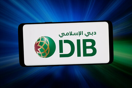 Stuttgart, Germany - 04-13-2026: In this photo illustration, the logo of financial company Dubai Islamic Bank (DIB) is displayed on a smartphone in front of abstract background on computer screen.