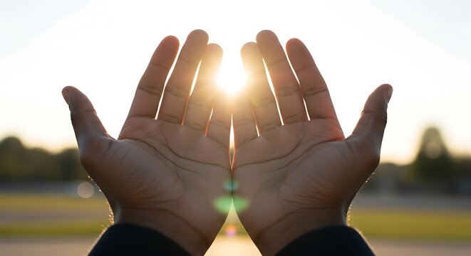 Hands reaching towards the bright sun symbolize hope, freedom, and spiritual awakening, capturing the essence of liberation and new beginnings.
