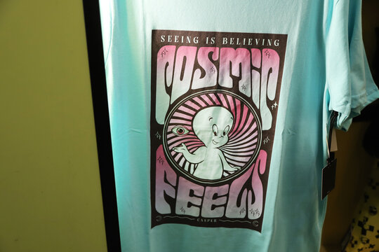 
Casper the Ghost t-shirt with retro psychedelic design for sale in store with clean background and copy space
