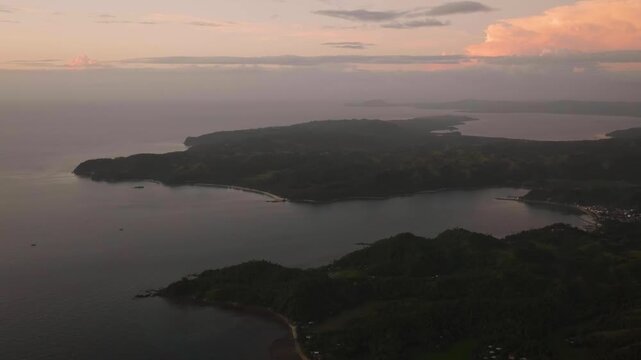 Tropical landscape of Island and blue sea. Dusky clouds in Santa Fe, Tablas, Romblon. Philippines.