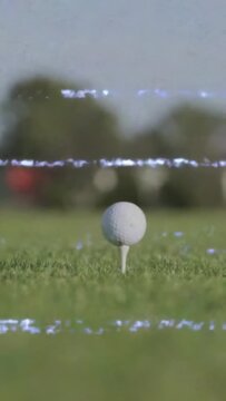 Vertical video: Driver entering behind ball causing glitches while leaving prepping shot for golf
